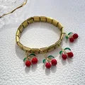 Charm colgante dorado cereza