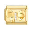 Charm dorado moñito