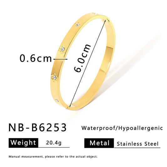 Bangle flores con brillos dorada