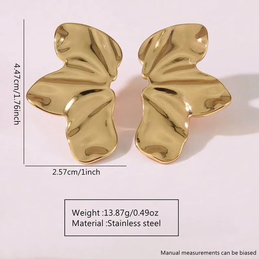 Aretes mitad de flor dorados
