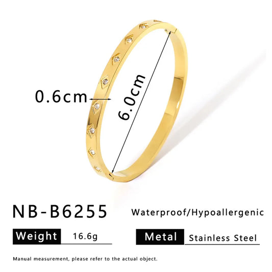 Bangle ojitos con brillos dorada
