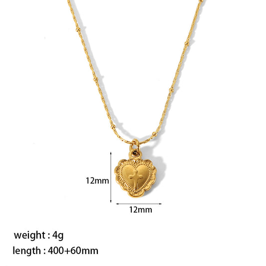 Collar cruz en corazon